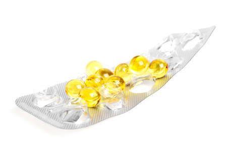 Cod liver oil omega 3 gel capsules on a white backgroundの写真素材