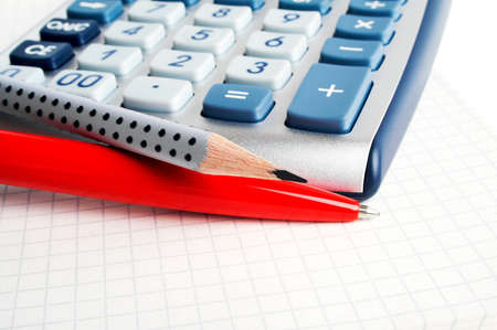 The calculator, pencil and pen, close upの写真素材