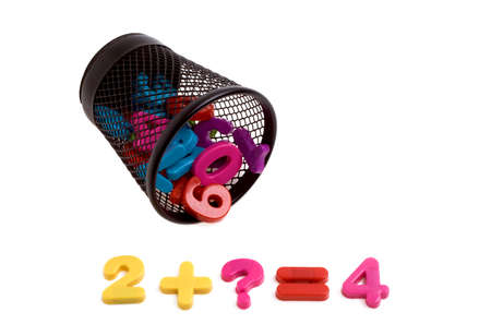 Colorful plastic numbers in black metal container isolated on white background