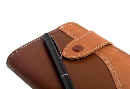 Notebook and a pen isolated on white backgroundの写真素材