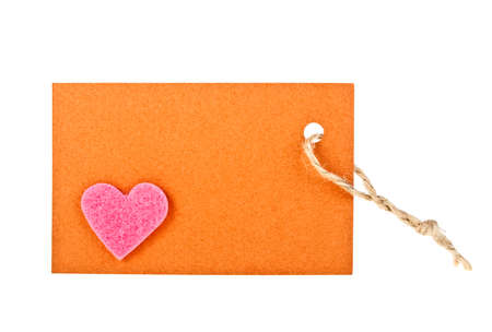 Brown paper label witn pink heart on white background