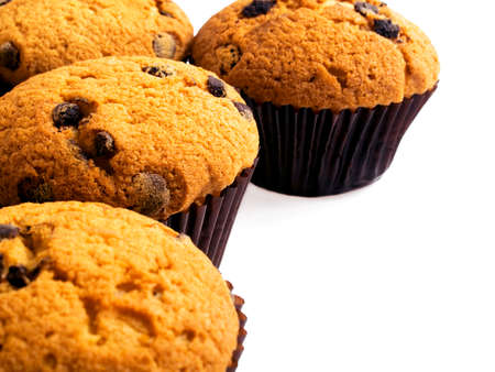 Chocolate chip muffins isolated on white background