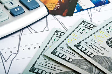 Business concept - credit cards, calculator and money