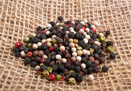 Colored peppers on burlap background