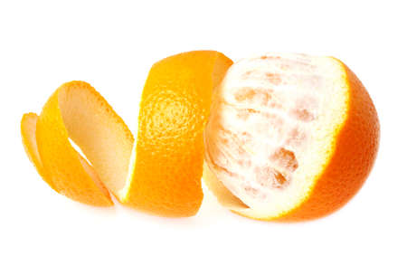Orange with peeled spiral skin isolated on a white backgroundの写真素材
