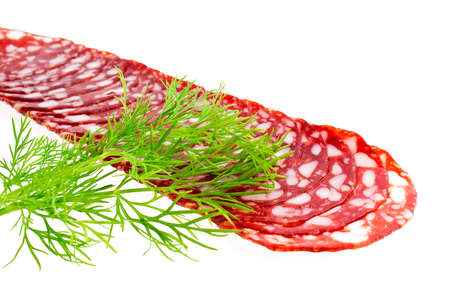 Slices of sausage with fennel isolated on a white backgroundの写真素材