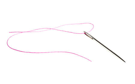 Needle for sewing and pink thread, isolated on a white backgroundの写真素材