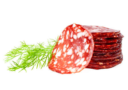 Slices of sausage with fennel isolated on a white backgroundの写真素材