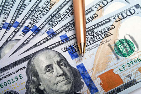 Business concept - money and penの写真素材