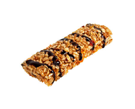 Healthy cereal bar with chocolate on a white backgroundの写真素材