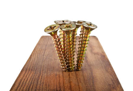 Screws screwed into wooden plankの写真素材