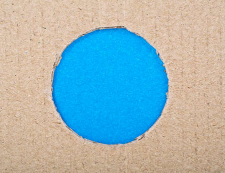 Smooth hole with blue paper and cardboardの写真素材
