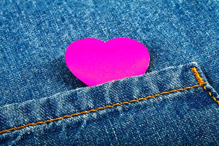 Violet heart in jeans pocketの写真素材