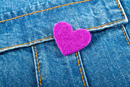 Violet heart in jeans pocketの写真素材
