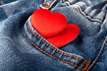Red hearts in jeans pocketの写真素材