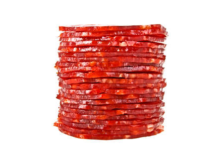 Stack of salami slices isolated on a white backgroundの写真素材