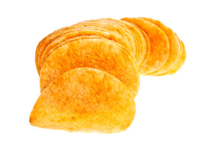 Heap of potato chips isolated on white backgroundの写真素材
