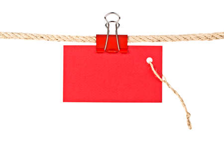 Red lable on a rope isolated on white background, closeupの写真素材