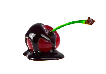 Cherry in chocolate on a white backgroundの写真素材
