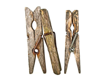 Old wooden clothespins isolated on white backgroundの写真素材