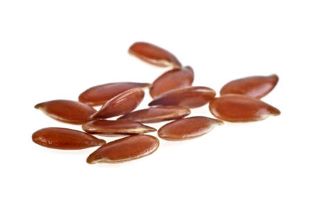 Close up of flax seeds isolated on white backgroundの写真素材