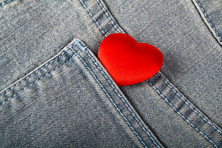 Red heart in jeans pocketの写真素材