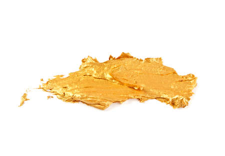 Strokes of golden paint isolated on white background