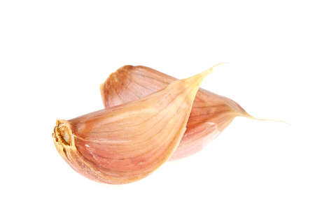 Two garlic cloves isolated on white backgroundの写真素材
