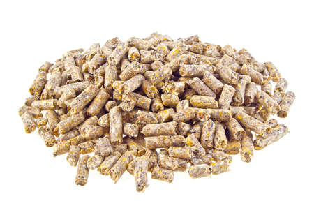 Pelleted compound feed for cattle isolated on white backgroundの写真素材