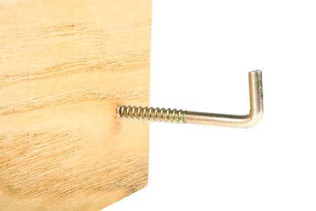 Screw hook screwed into the wooden plank, white backgroundの写真素材