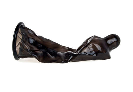 Black condom isolated on white background, ready to useの写真素材