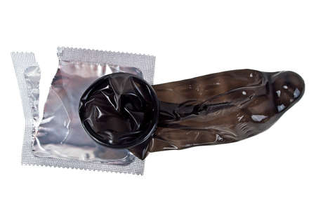 Black condom isolated on white background, ready to useの写真素材