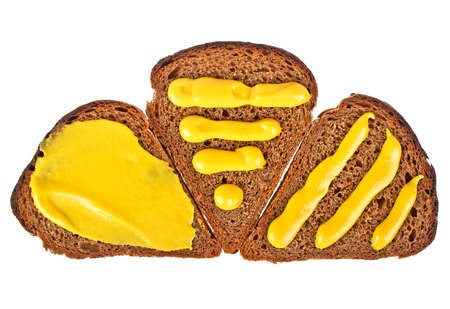 Rye bread slices and mustard isolated on white backgroundの写真素材