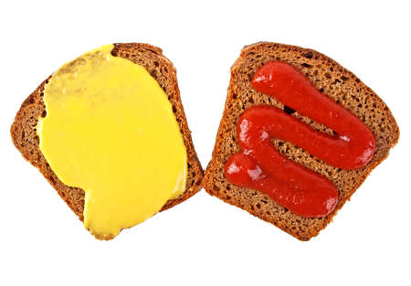 Rye bread slices with mustard and ketchup isolated on white backgroundの写真素材