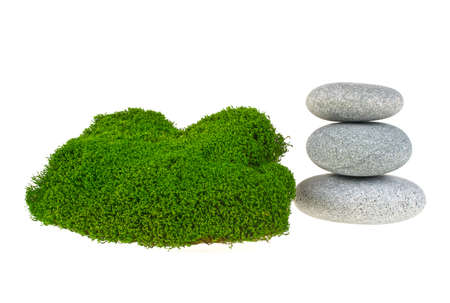 Green moss and spa stones on white backgroundの写真素材