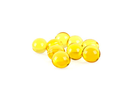Cod liver oil omega 3 gel capsules on a white backgroundの写真素材