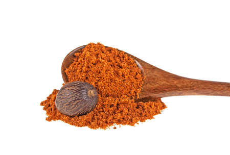 Nutmeg powder in wooden spoon isolated on white backgroundの写真素材