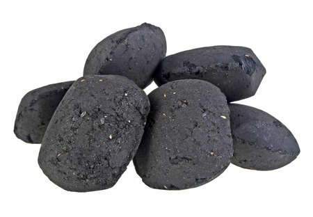 Charcoal briquettes on white backgroundの写真素材