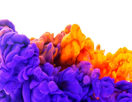 Violet and orange ink in water isolated on white backgroundの写真素材