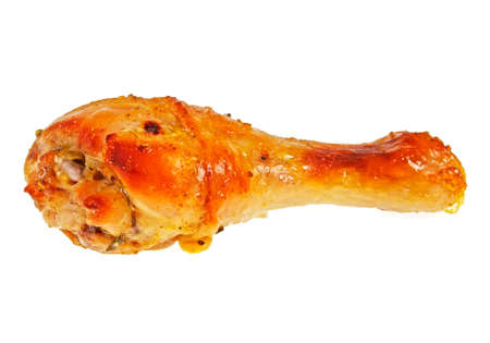 Grilled chicken leg on a white backgroundの写真素材
