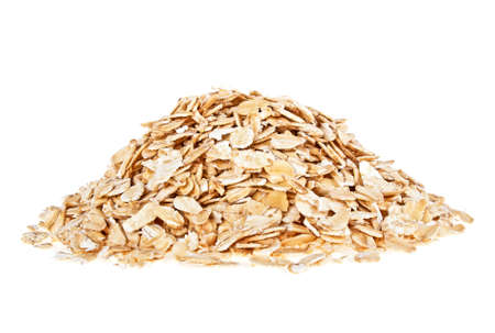 Oat flakes heap isolated on a white background