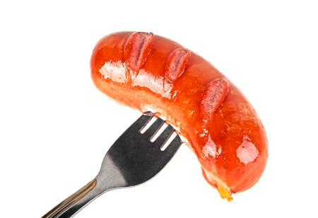 Grilled sausage on a forkの写真素材