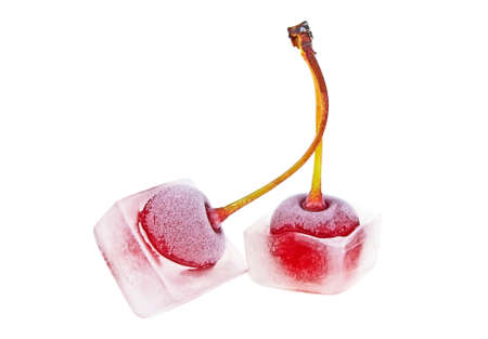 Two cherries in ice cubes on a white backgroundの写真素材