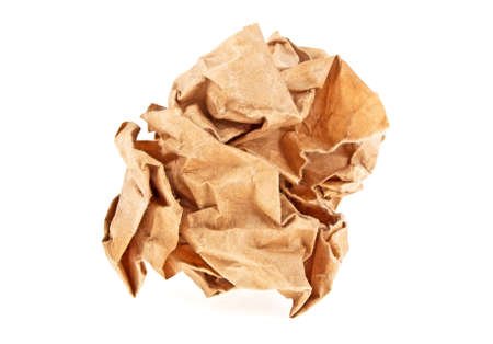 Crumpled brown paper on white backgroundの写真素材