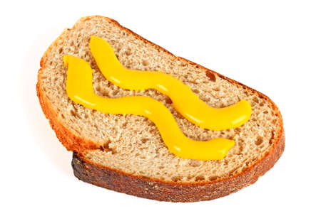 Slice of bread and mustard isolated on a white backgroundの写真素材