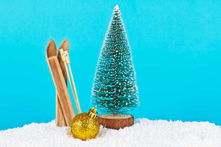 Christmas decoration on blue background. Christmas tree, Christmas ball and skis on a blue background.の写真素材