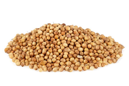 Coriander seeds isolated on white backgroundの写真素材