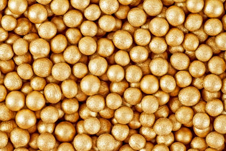 Close up of little golden ballsの写真素材