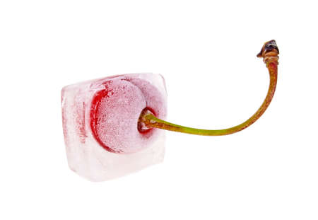Cherry frozen in ice cube, white backgroundの写真素材
