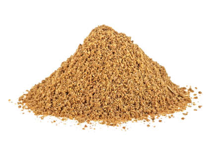 Pile of ground coriander on a white backgroundの写真素材
